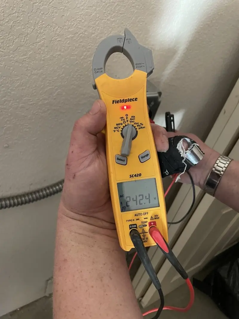 Voltage testing with clamp meter during Whole House Surge Protector in Kent